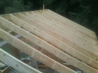 New roof rafters set over an addition before sheathing in Ponte Vedra